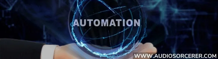 A hand holding a blue transparent sphere with the word automation in it.