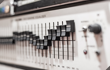 Audio equalizer with black faders.