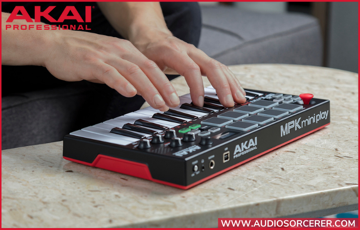 Promo picture of hands playing the Akai Professional MPK Mini Play3 MIDI controller.