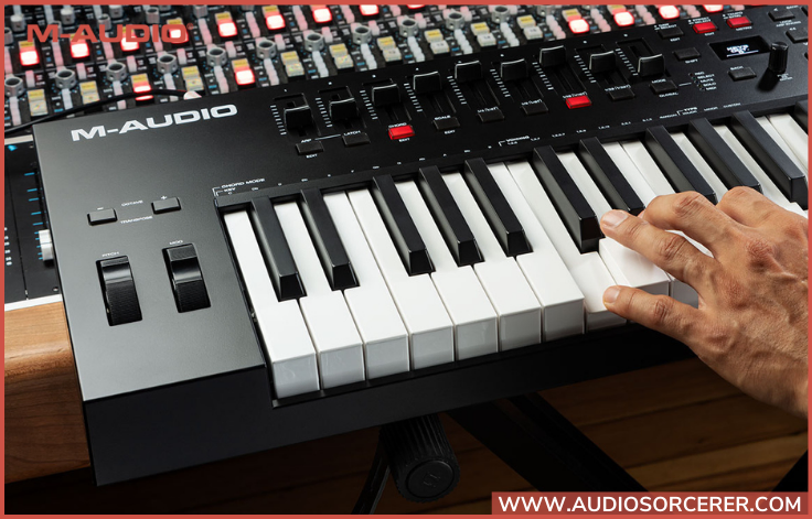 Promo picture of a hand playing the M-Audio Oxygen Pro 61 MIDI Controller.