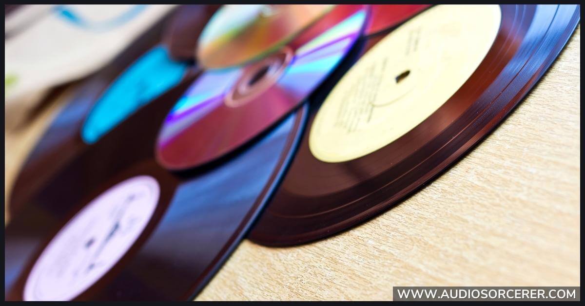 Several music records sitting on a table.