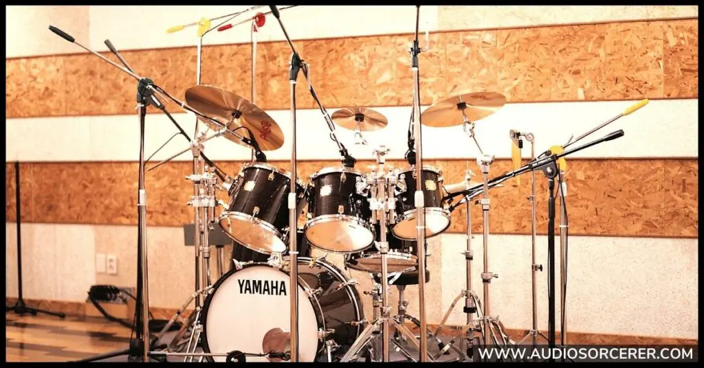 A Yamaha drum kit miked up in a recording studio.