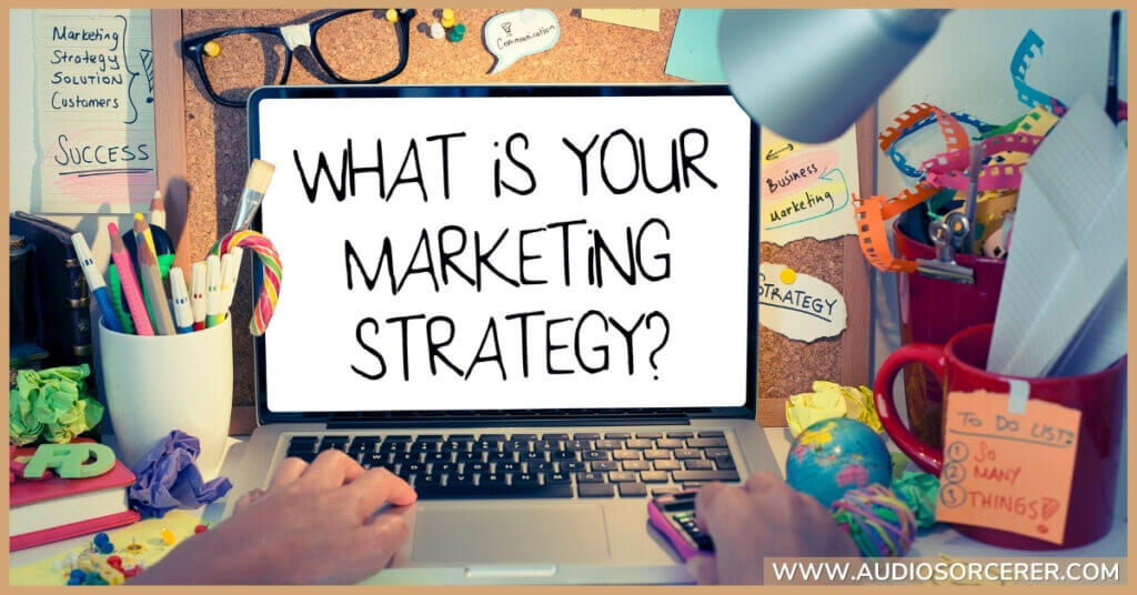 The text "What Is Your Marketing Strategy?" on a laptop screen.